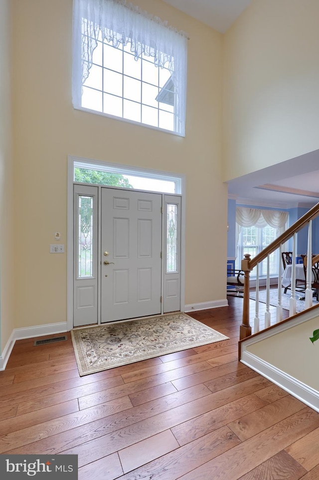 1350 Hyde Park Dr, Lancaster, PA 17601 - entrance foyer with a towering ceiling, wood-type flooring, stairway, and baseboards