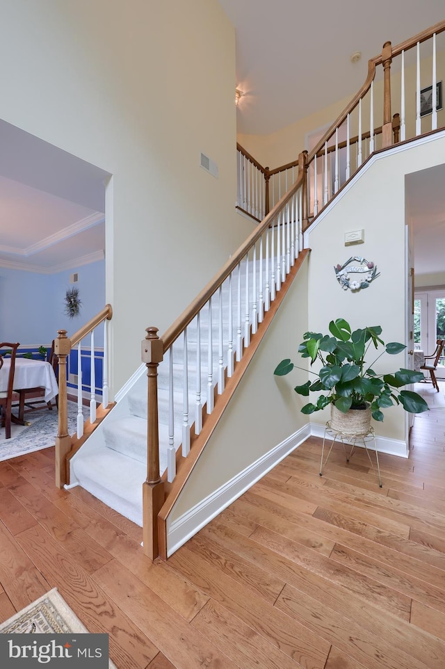 1350 Hyde Park Dr, Lancaster, PA 17601 - stairs with hardwood / wood-style flooring, baseboards, a high ceiling, and ornamental molding