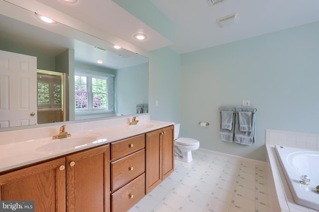 1350 Hyde Park Dr, Lancaster, PA 17601 - full bathroom featuring a garden tub, a stall shower, toilet, double vanity, and tile patterned floors