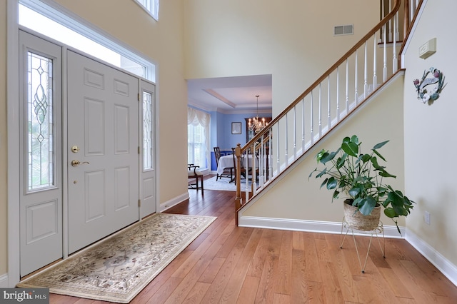 1350 Hyde Park Dr, Lancaster, PA 17601 - entrance foyer featuring stairs, a chandelier, hardwood / wood-style flooring, and baseboards