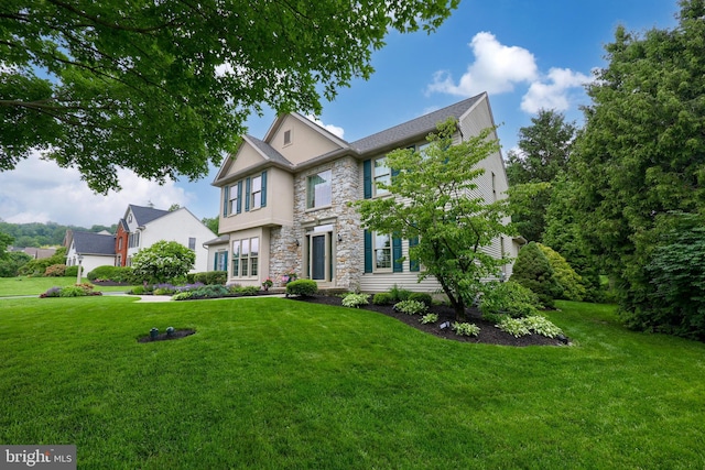 1350 Hyde Park Dr, Lancaster, PA 17601 - view of front of home featuring stone siding, a front yard, and stucco siding