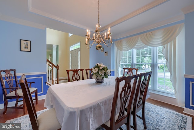1350 Hyde Park Dr, Lancaster, PA 17601 - dining area with a chandelier, wood finished floors, crown molding, baseboards, and a raised ceiling