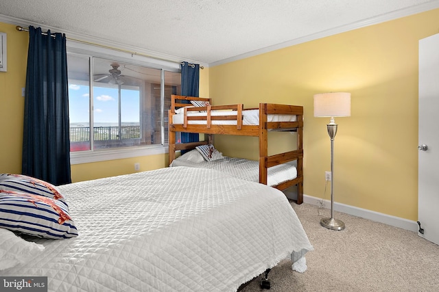 11400 Coastal Hwy Unit 8G, Ocean City, MD 21842 - bedroom with ornamental molding, carpet flooring, baseboards, and a textured ceiling