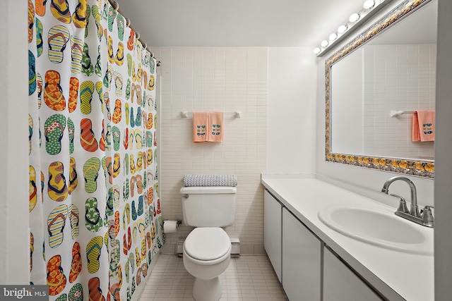 11400 Coastal Hwy Unit 8G, Ocean City, MD 21842 - bathroom with tile walls, tile patterned floors, toilet, vanity, and curtained shower