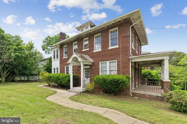 4100 Jenifer St NW, Washington, DC 20015 - view of front of home featuring a front yard, brick siding, and a chimney