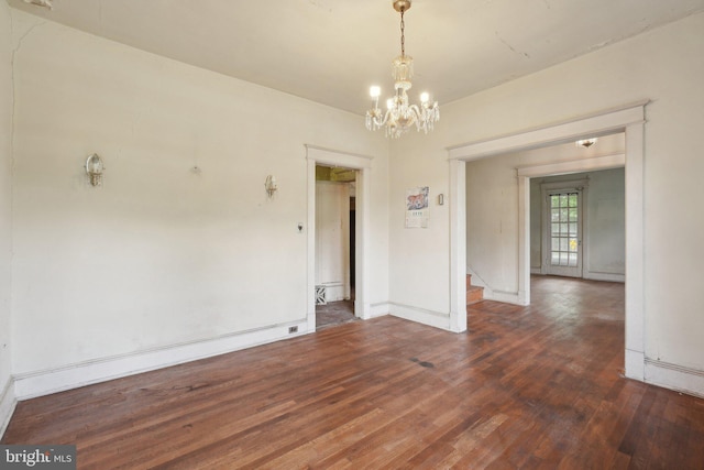 4100 Jenifer St NW, Washington, DC 20015 - unfurnished room with a chandelier, wood finished floors, stairway, and baseboards