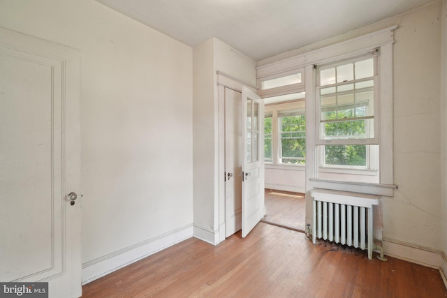 4100 Jenifer St NW, Washington, DC 20015 - unfurnished room featuring radiator, hardwood / wood-style floors, and baseboards