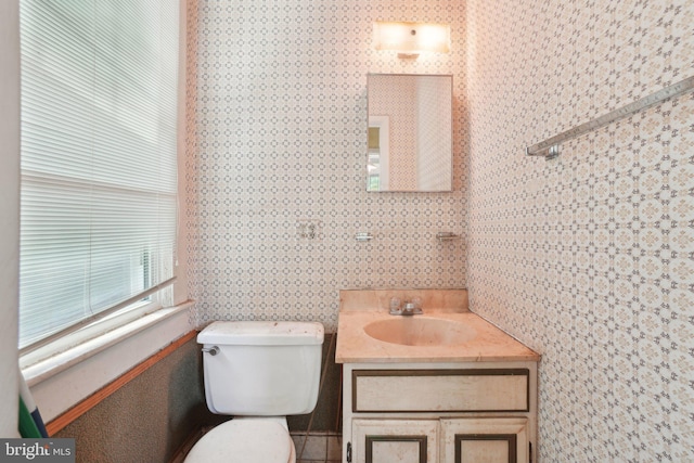 4100 Jenifer St NW, Washington, DC 20015 - half bath featuring vanity, toilet, and wallpapered walls