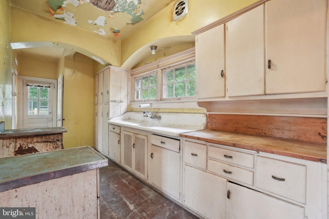 4100 Jenifer St NW, Washington, DC 20015 - kitchen featuring wooden counters, a sink, and arched walkways