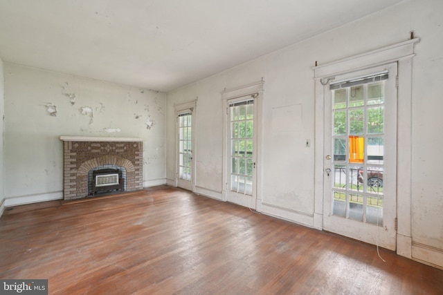 4100 Jenifer St NW, Washington, DC 20015 - unfurnished living room with wood finished floors and a fireplace