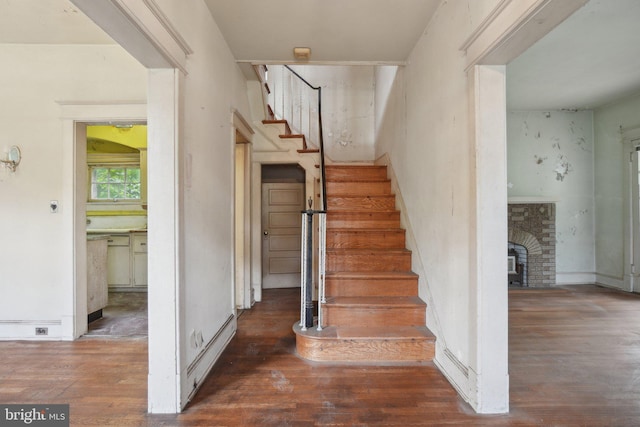 4100 Jenifer St NW, Washington, DC 20015 - stairway featuring wood finished floors and a fireplace