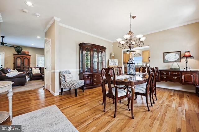 24830 Showbarn Cir, Damascus, MD 20872 - dining area with a chandelier, healthy amount of natural light, light wood-type flooring, ornamental molding, and ceiling fan