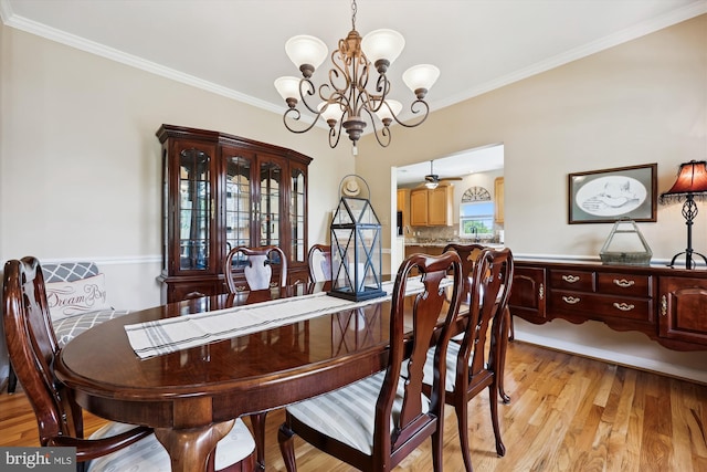 24830 Showbarn Cir, Damascus, MD 20872 - dining space with a chandelier, crown molding, and light wood-style flooring