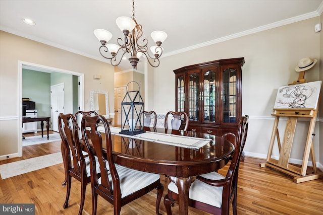 24830 Showbarn Cir, Damascus, MD 20872 - dining area featuring a chandelier, wood finished floors, crown molding, an office area, and baseboards