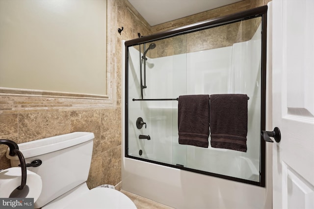 24830 Showbarn Cir, Damascus, MD 20872 - bathroom featuring shower / bath combination with glass door, toilet, and tile walls