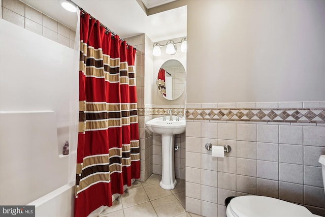 24830 Showbarn Cir, Damascus, MD 20872 - bathroom with tile walls, toilet, tile patterned flooring, shower / bath combo with shower curtain, and wainscoting