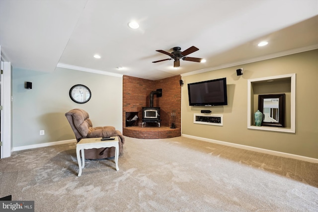 24830 Showbarn Cir, Damascus, MD 20872 - carpeted living area with a wood stove, a ceiling fan, crown molding, baseboards, and recessed lighting