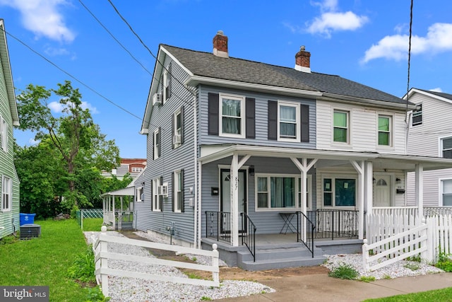 827 W 2nd St, Florence, NJ 08518 - view of front of home featuring a porch, a chimney, a front lawn, and cooling unit