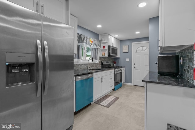 827 W 2nd St, Florence, NJ 08518 - kitchen featuring appliances with stainless steel finishes, a sink, white cabinets, recessed lighting, and backsplash