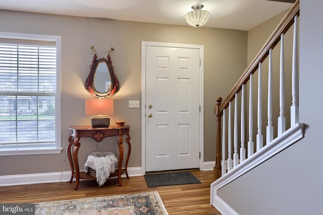 402 Cobblestone Ln, Lancaster, PA 17601 - entrance foyer featuring plenty of natural light, wood finished floors, stairway, and baseboards