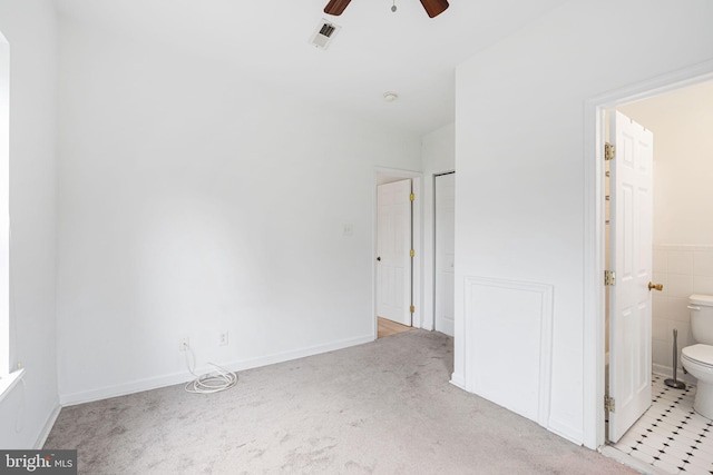 909 S 20th St Unit 3, Philadelphia, PA 19146 - unfurnished bedroom with connected bathroom, carpet floors, and a ceiling fan