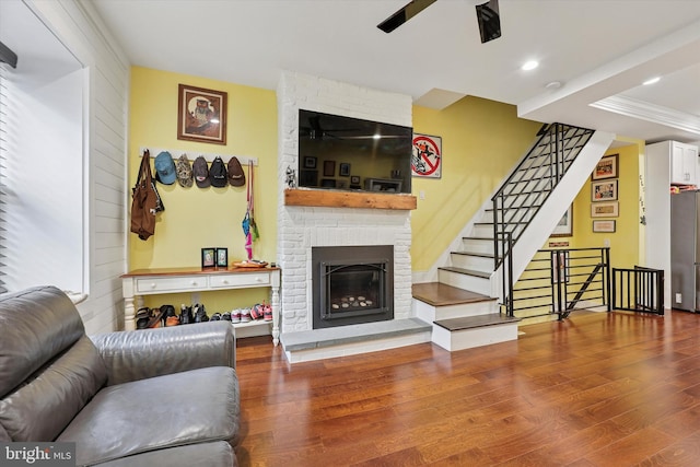 224 Dupont St, Philadelphia, PA 19127 - living room featuring a fireplace, wood finished floors, stairway, ceiling fan, and recessed lighting