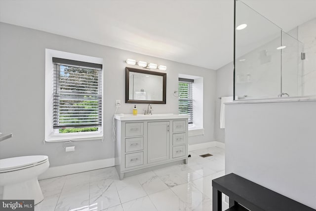 224 Dupont St, Philadelphia, PA 19127 - full bath featuring marble look tiles, plenty of natural light, a marble finish shower, and vanity