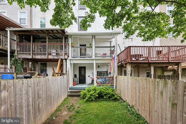 224 Dupont St, Philadelphia, PA 19127 - rear view of house with stucco siding and a wooden deck