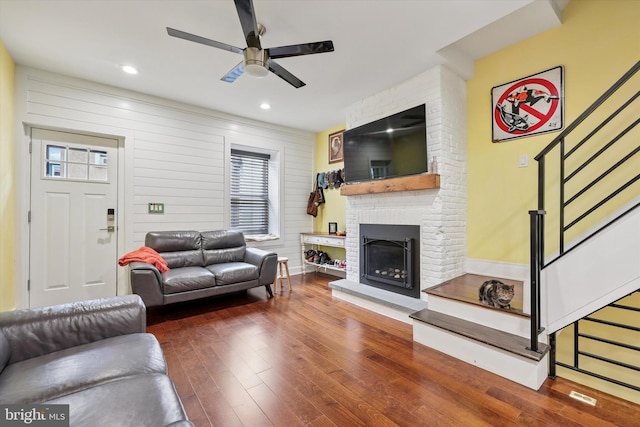 224 Dupont St, Philadelphia, PA 19127 - living area with stairs, ceiling fan, hardwood / wood-style floors, a fireplace, and baseboards