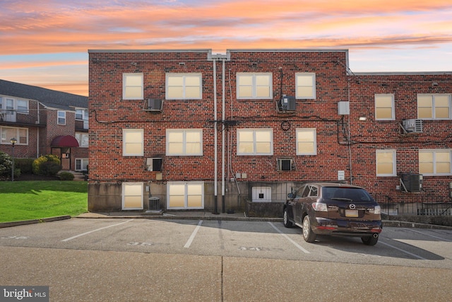 6901 Valley Ave Unit H2, Philadelphia, PA 19128 - property at dusk with uncovered parking and cooling unit