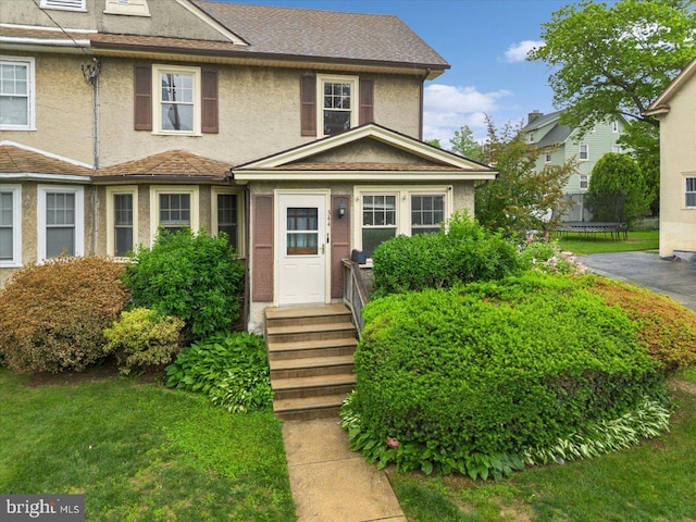 344 Clearbrook Ave, Lansdowne, PA 19050 - view of front facade featuring stucco siding and a trampoline