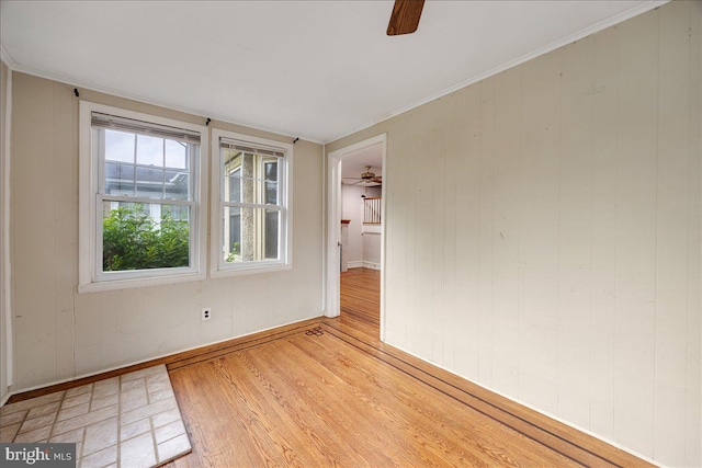 344 Clearbrook Ave, Lansdowne, PA 19050 - empty room featuring ceiling fan, light wood finished floors, wood walls, and baseboards
