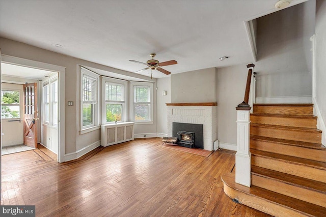 344 Clearbrook Ave, Lansdowne, PA 19050 - unfurnished living room with radiator, a ceiling fan, light wood-style floors, and stairway