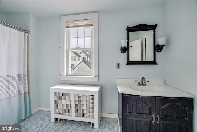 344 Clearbrook Ave, Lansdowne, PA 19050 - bathroom with radiator heating unit, vanity, baseboards, and tile patterned floors