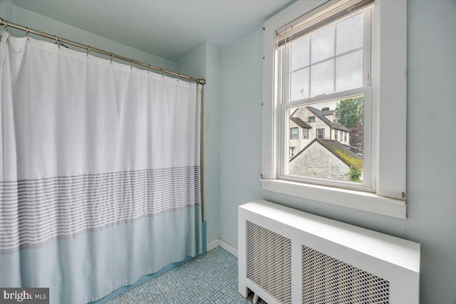 344 Clearbrook Ave, Lansdowne, PA 19050 - bathroom featuring radiator heating unit, tile patterned flooring, baseboards, and a shower with shower curtain