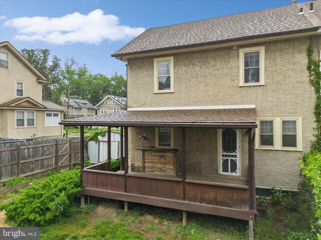 344 Clearbrook Ave, Lansdowne, PA 19050 - back of property featuring stucco siding, a wooden deck, and roof with shingles