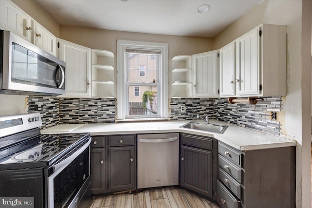 344 Clearbrook Ave, Lansdowne, PA 19050 - kitchen with open shelves, appliances with stainless steel finishes, a sink, white cabinetry, and recessed lighting
