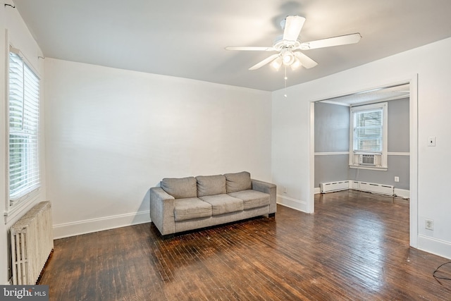 4749 Marple St, Philadelphia, PA 19136 - living area with radiator heating unit, wood finished floors, a baseboard heating unit, and ceiling fan
