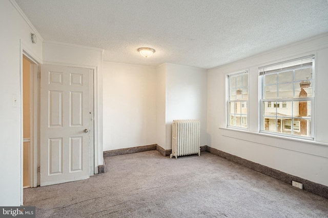 4749 Marple St, Philadelphia, PA 19136 - spare room with radiator heating unit, carpet, crown molding, a textured ceiling, and baseboards
