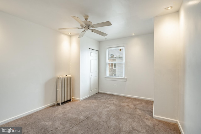 4749 Marple St, Philadelphia, PA 19136 - empty room featuring radiator, carpet floors, ceiling fan, and baseboards