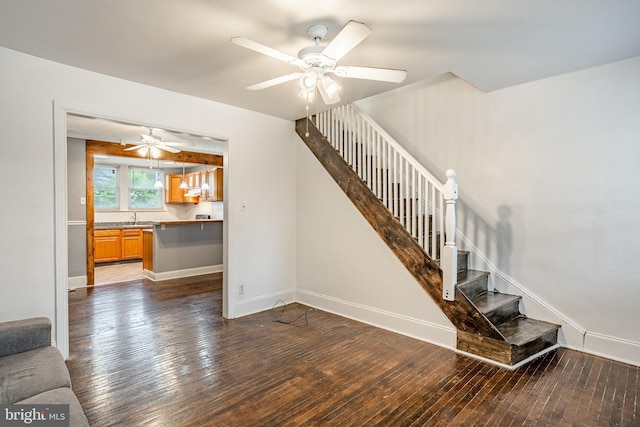 4749 Marple St, Philadelphia, PA 19136 - staircase with hardwood / wood-style flooring, a ceiling fan, and baseboards