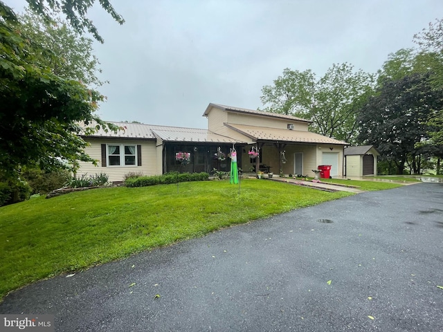 101 Foltz Rd, Shippensburg, PA 17257 - view of front of property featuring an attached garage, a front yard, driveway, and metal roof