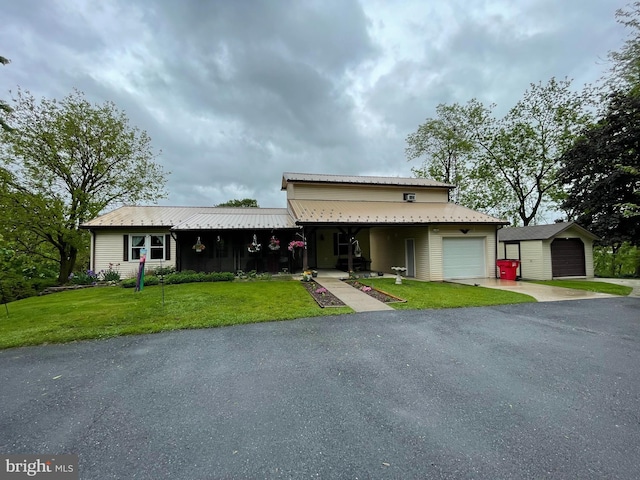 101 Foltz Rd, Shippensburg, PA 17257 - view of front facade with a garage, a front lawn, driveway, and metal roof