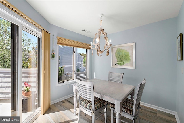 39724 E Sun Dr Unit 226, Fenwick Island, DE 19944 - dining area with a chandelier, wood finished floors, and baseboards