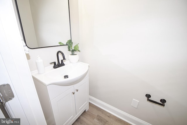 2116 E Hoffman St, Baltimore, MD 21213 - bathroom with vanity and wood finished floors