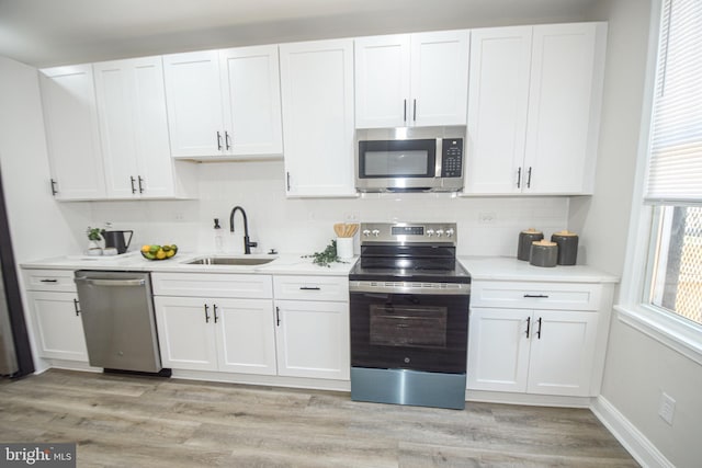 2116 E Hoffman St, Baltimore, MD 21213 - kitchen featuring stainless steel appliances and white cabinetry
