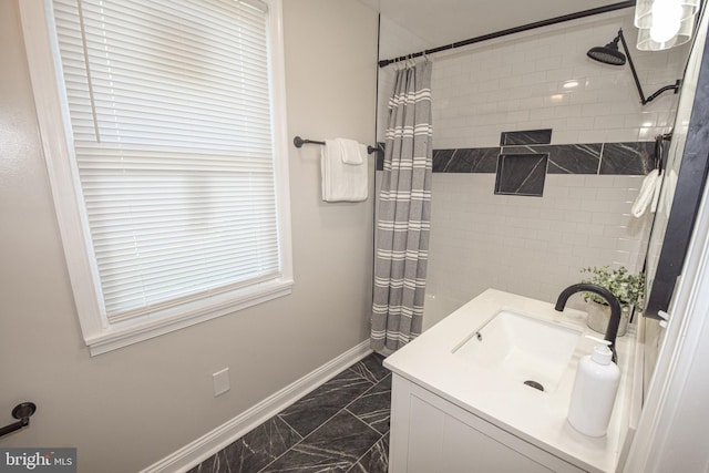 2116 E Hoffman St, Baltimore, MD 21213 - full bathroom with marble finish floors, a shower with curtain, and vanity