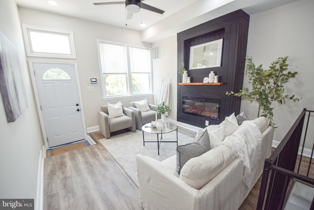 2116 E Hoffman St, Baltimore, MD 21213 - living area featuring a ceiling fan, healthy amount of natural light, wood finished floors, a large fireplace, and recessed lighting
