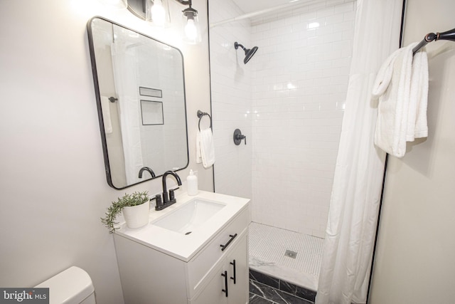 2116 E Hoffman St, Baltimore, MD 21213 - bathroom with a stall shower, vanity, and marble look tile flooring