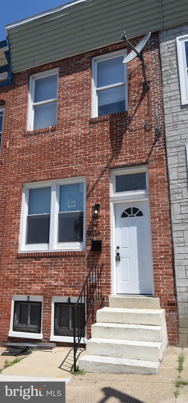 2116 E Hoffman St, Baltimore, MD 21213 - view of front of house with brick siding